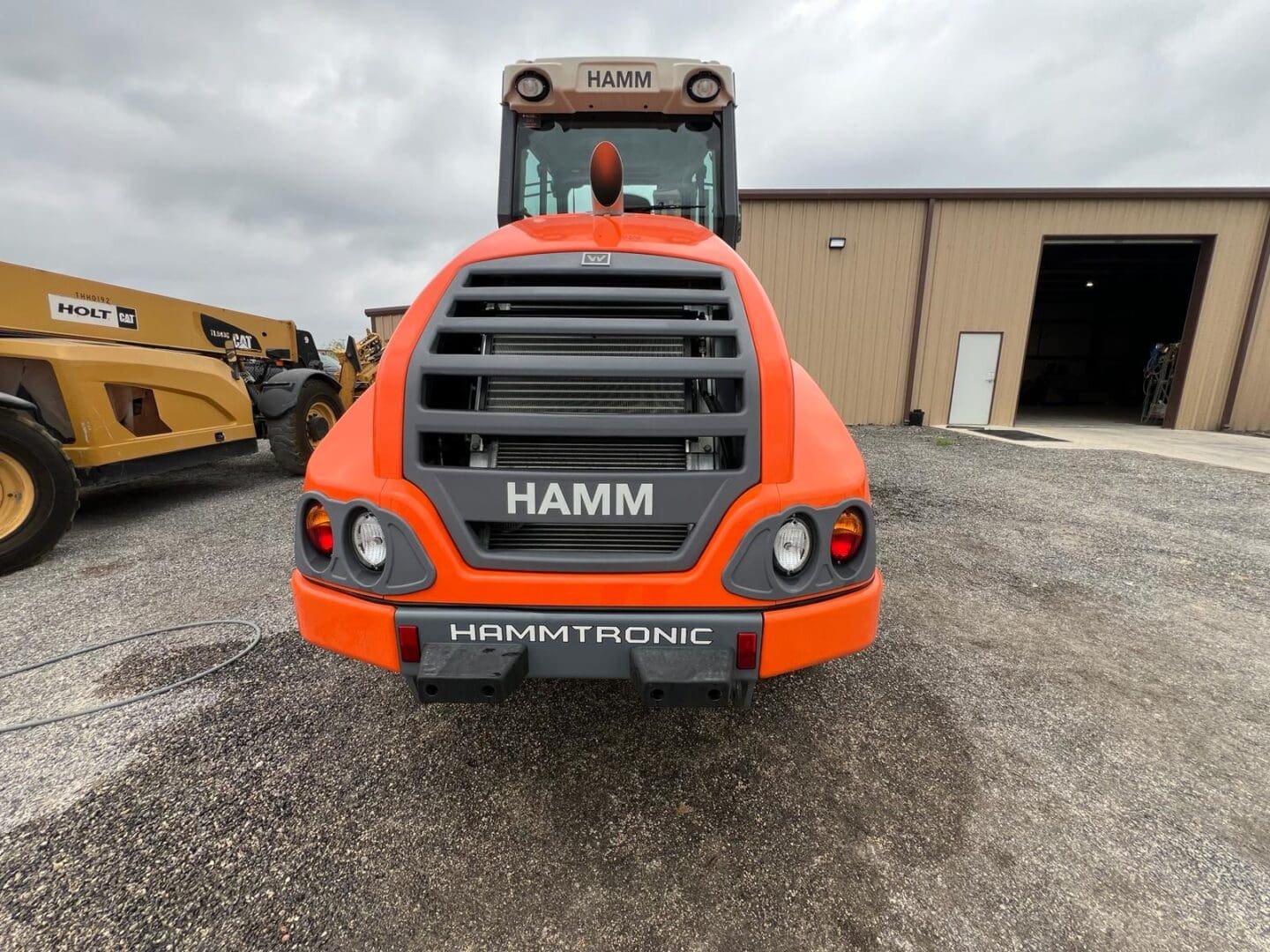 Orange HAMM road roller compactor front view