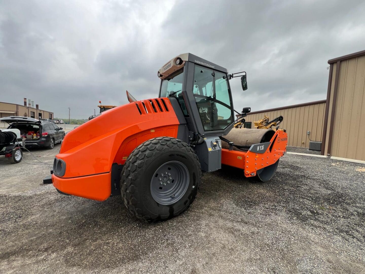 Orange single-drum road roller compactor