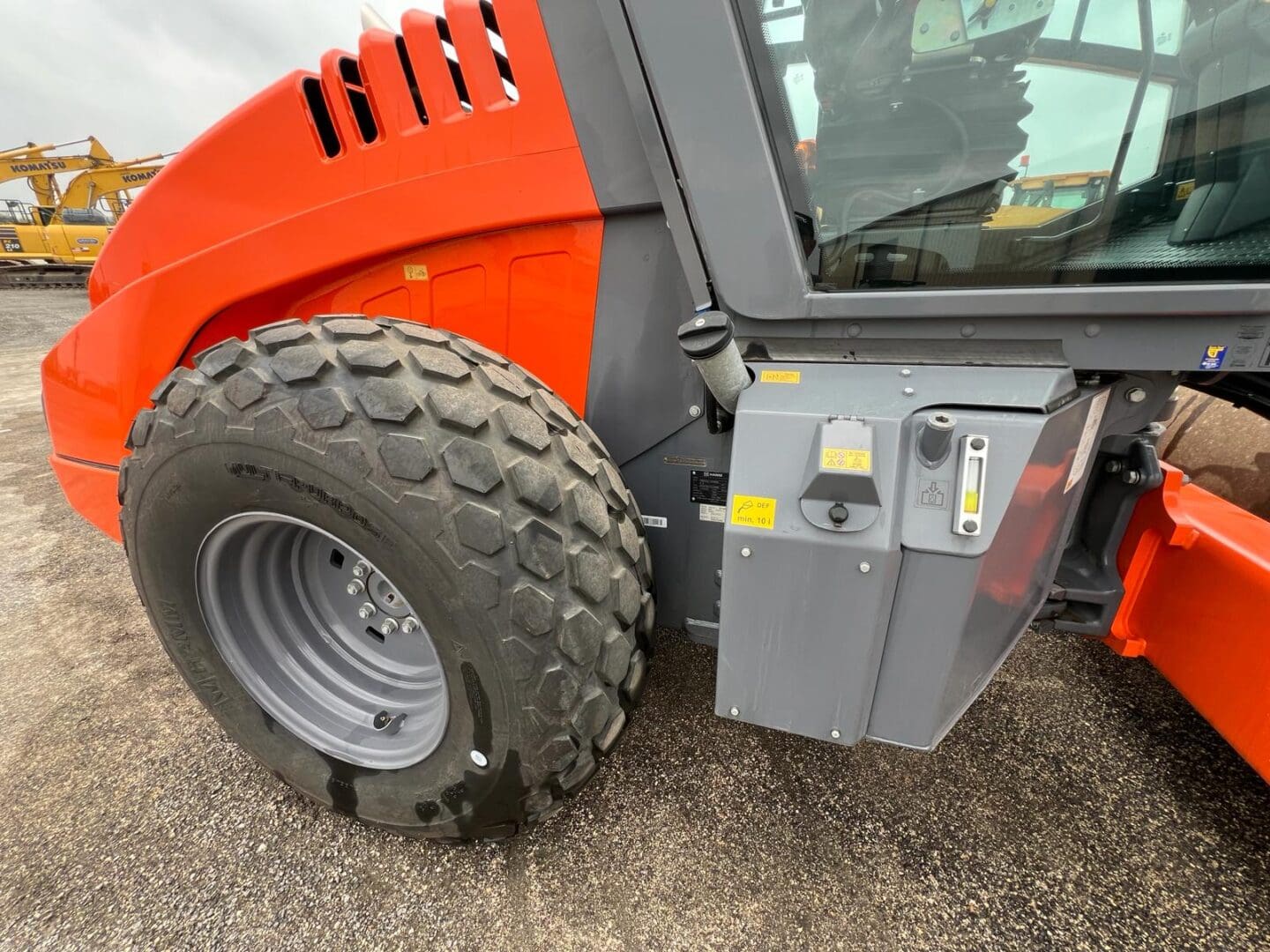 Close-up of orange heavy machinery wheel