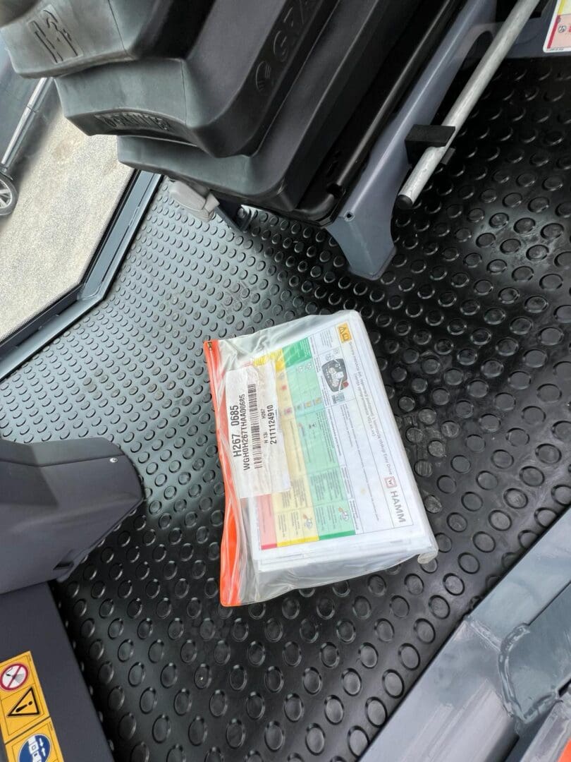 Labeled plastic parcel on bus rubber floor