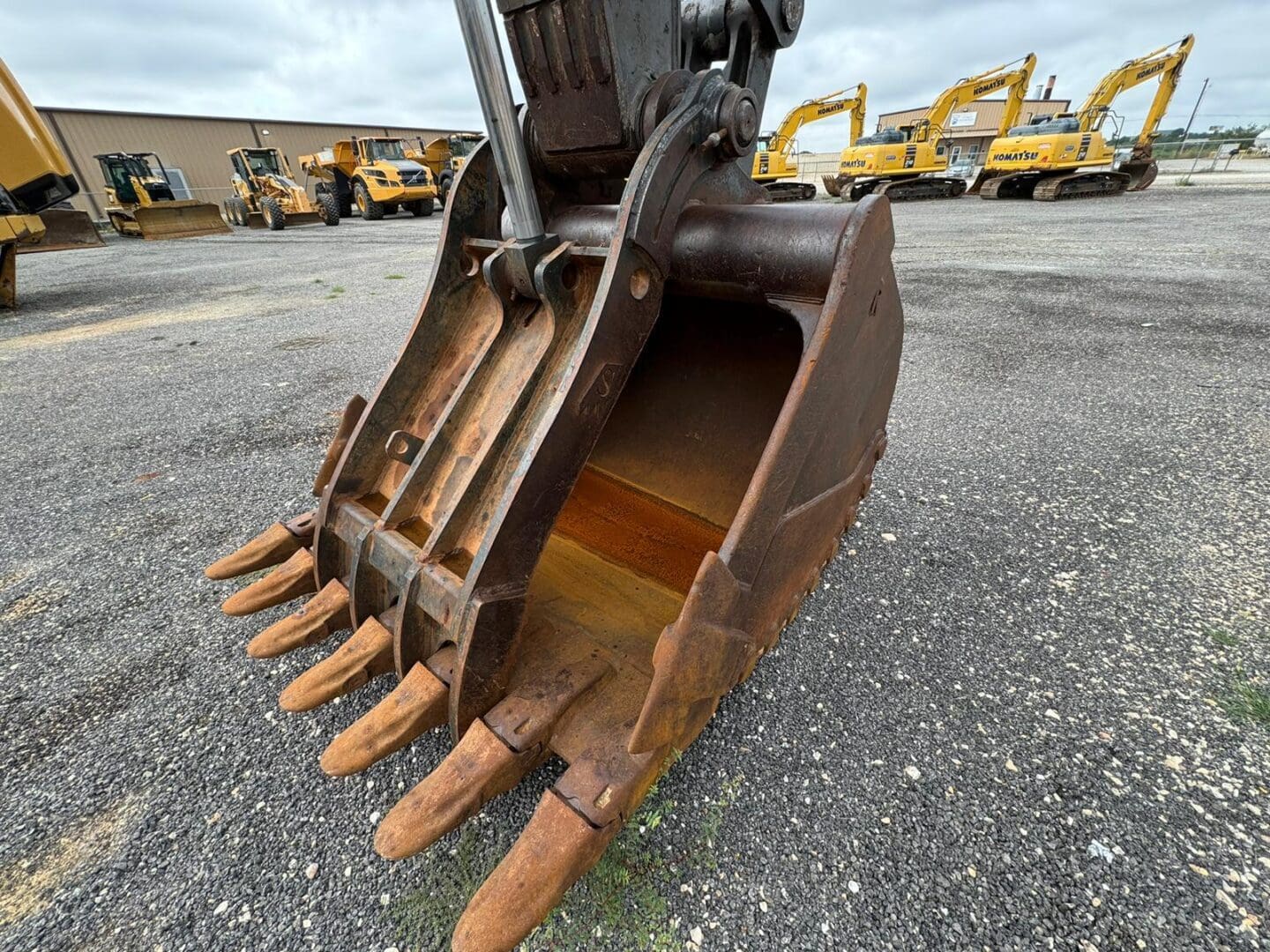 Close-up of worn excavator bucket teeth
