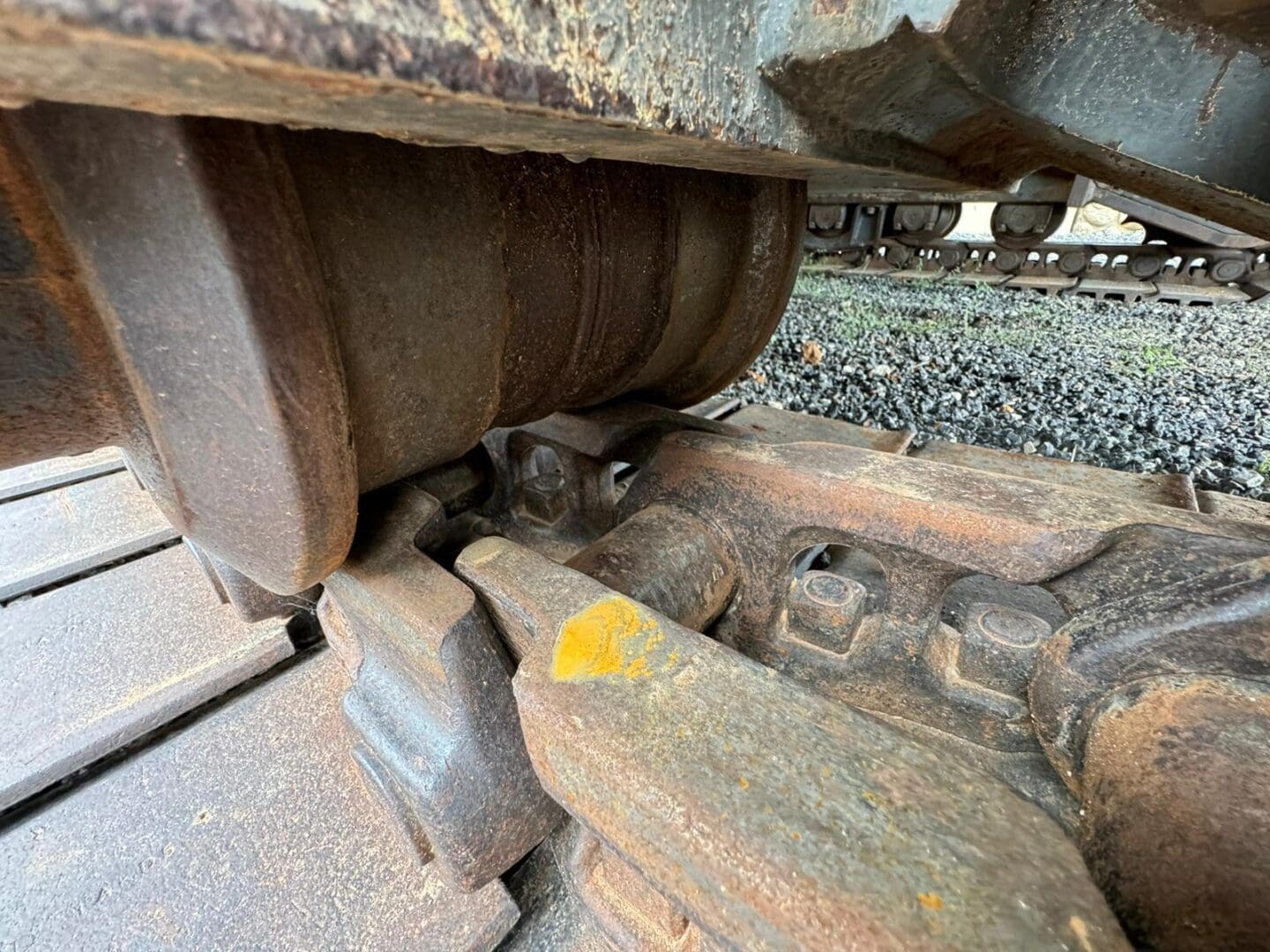 Rusted excavator track roller close-up