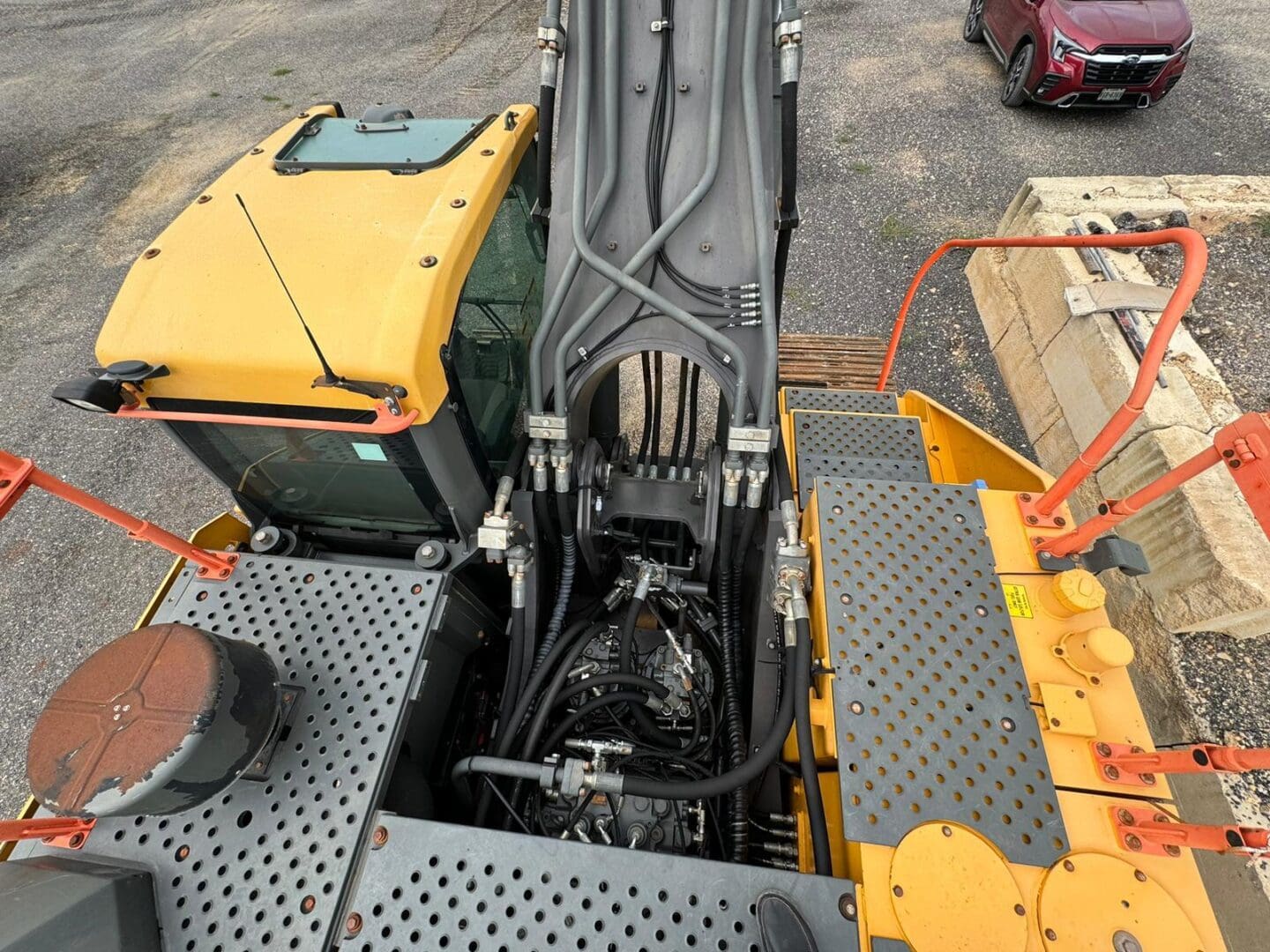Overhead view of excavator cab and hydraulics