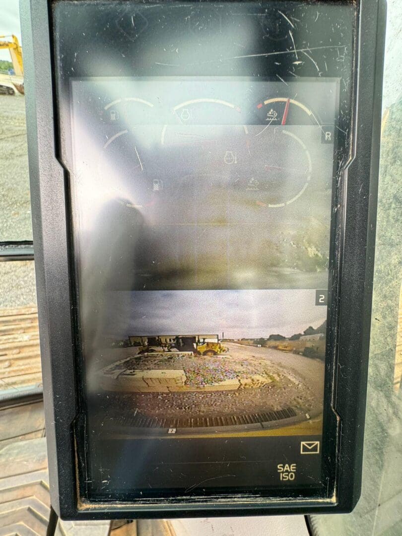 Construction vehicle monitor showing rear camera