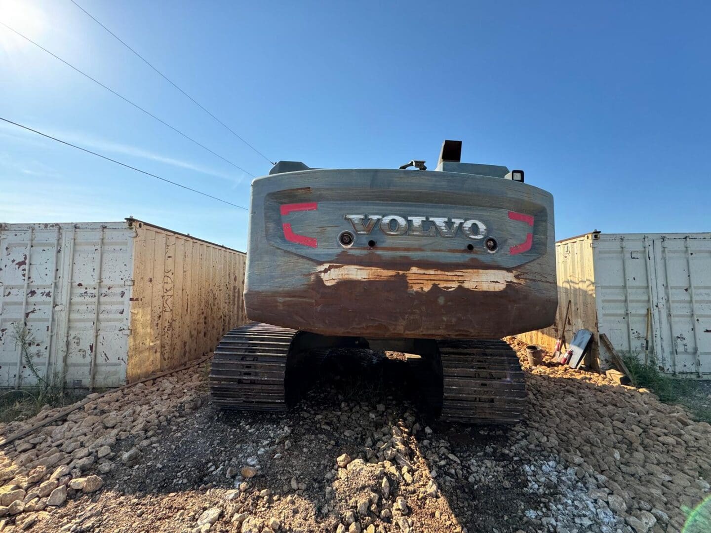 Rear of Volvo excavator on dirt mound