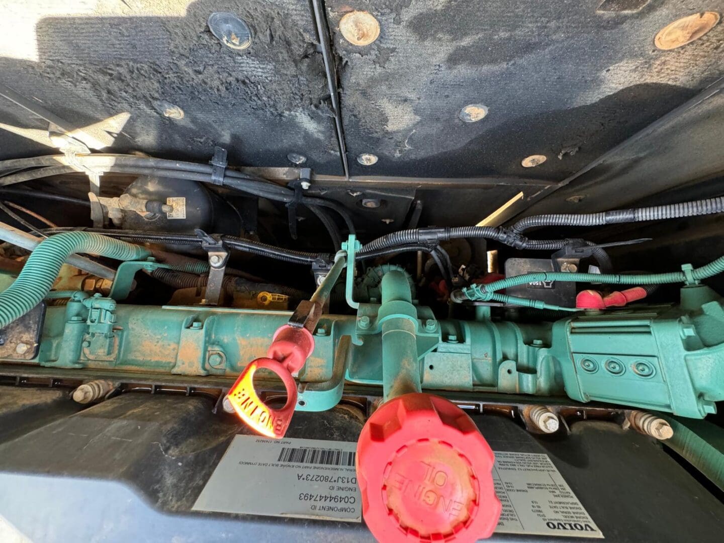 Green diesel engine with red oil cap
