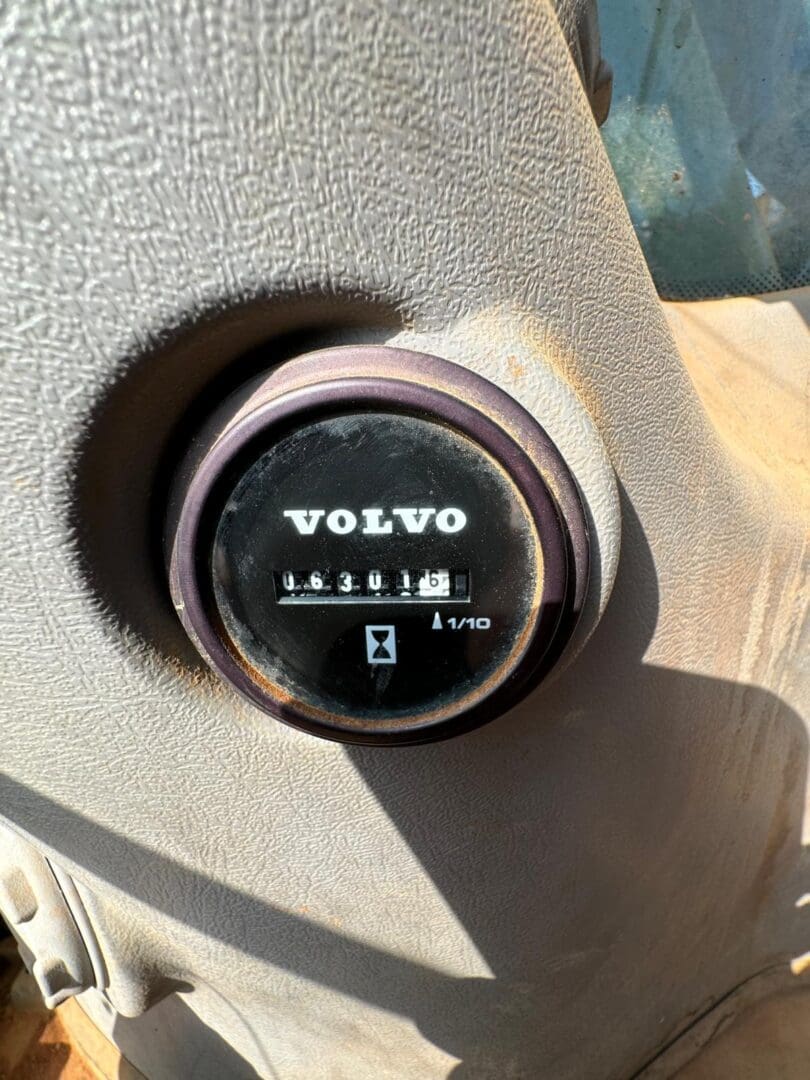 Volvo hour meter on beige dashboard