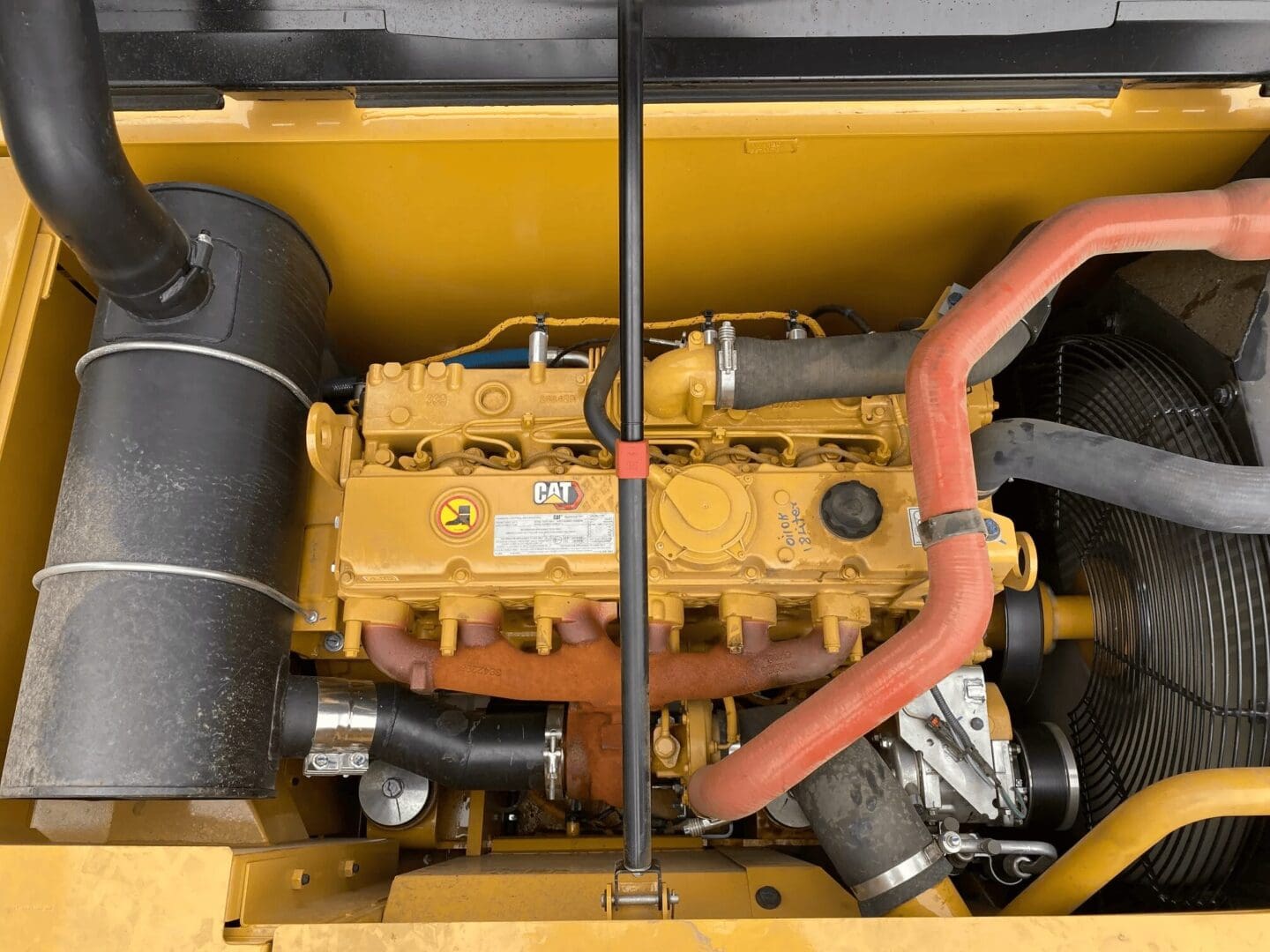 Yellow Caterpillar diesel engine with cooling fan