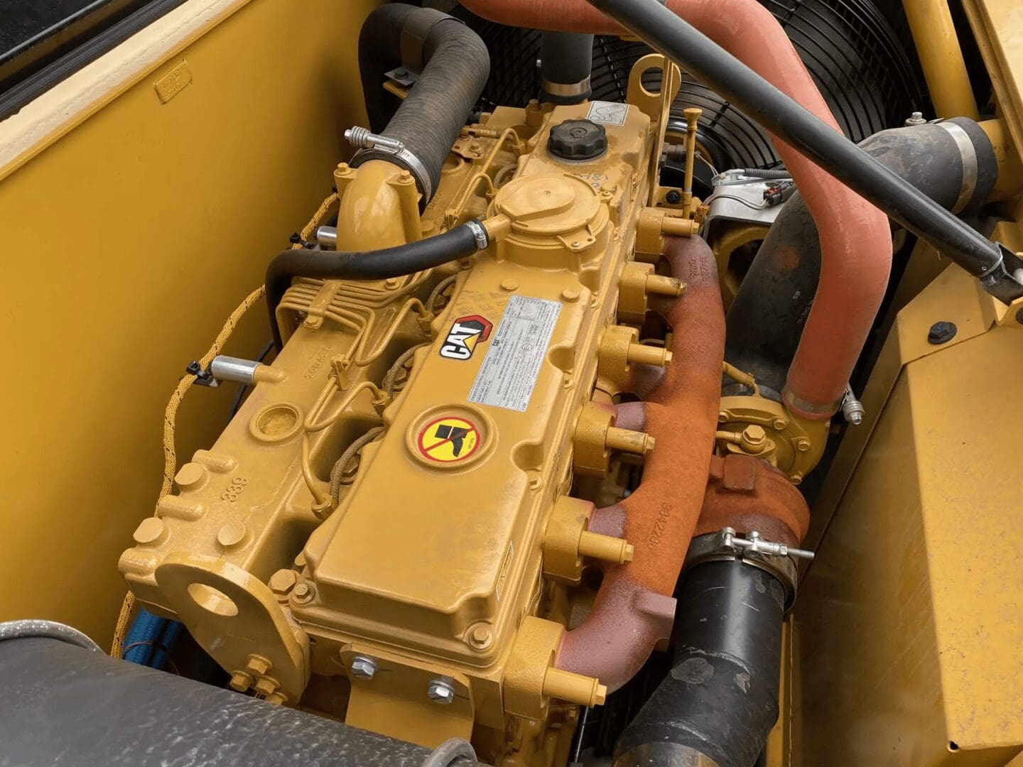 Yellow industrial diesel engine with hoses