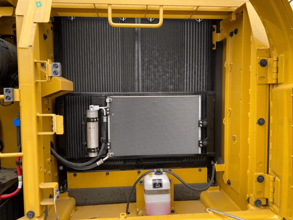 Yellow construction machinery radiator and coolant reservoir