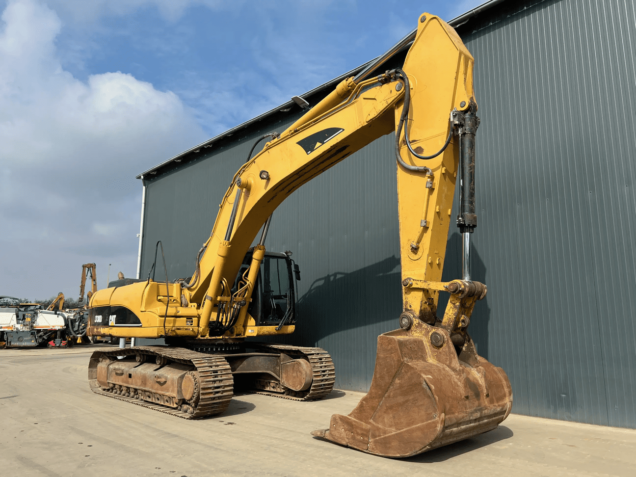 Yellow tracked excavator construction equipment with bucket