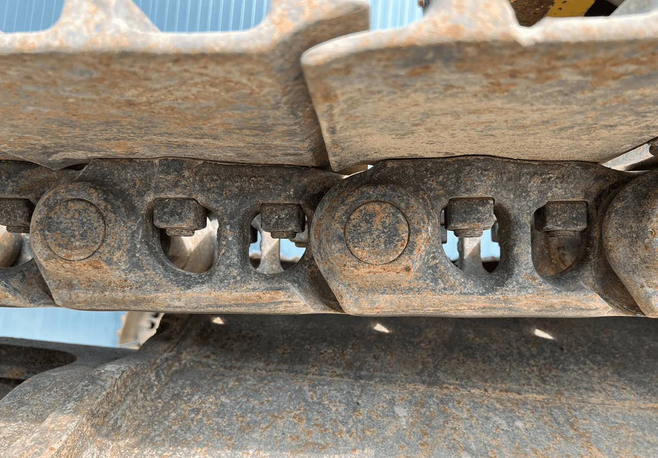 Close-up of rusty excavator track chain
