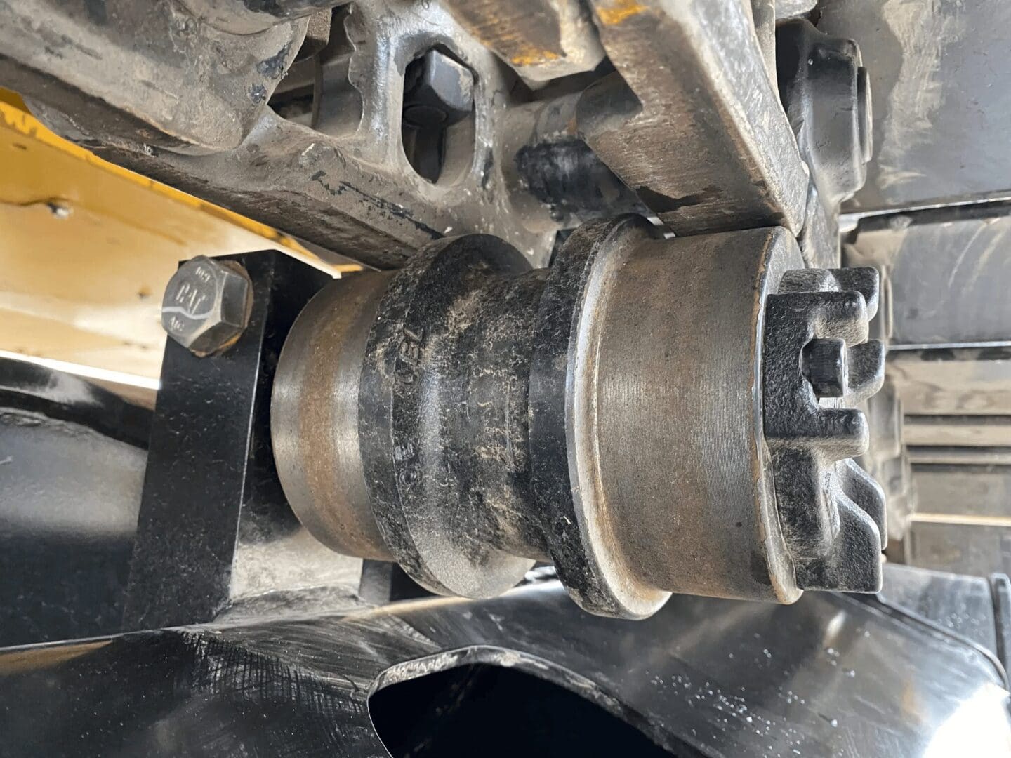 Excavator undercarriage track roller close-up