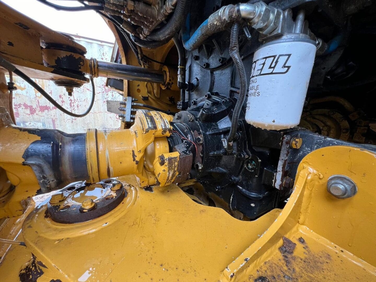 Close-up of yellow construction equipment engine