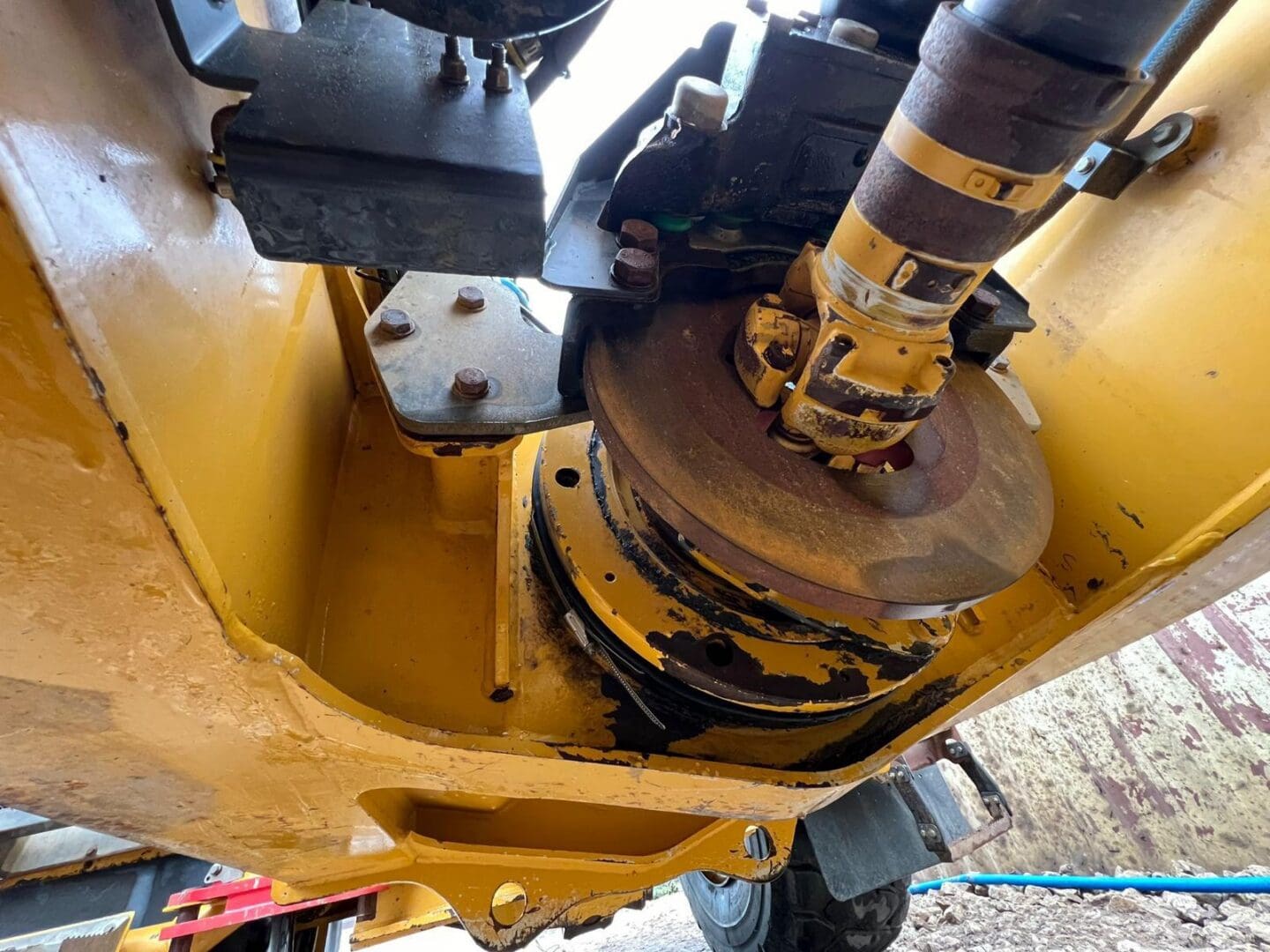 Close-up of yellow hydraulic machinery coupling