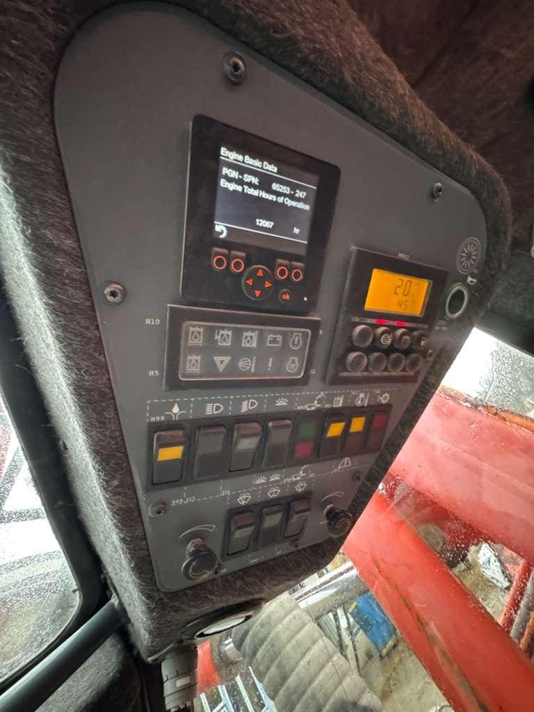 Heavy machinery control panel with screens