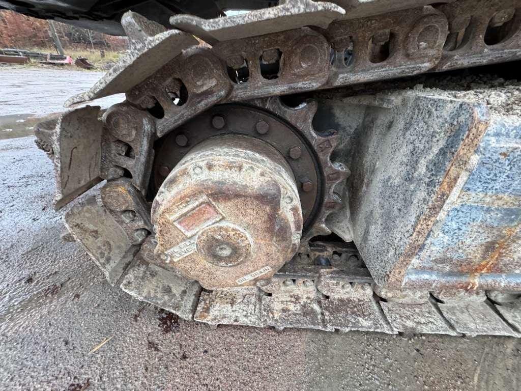 Rusty excavator track and drive sprocket