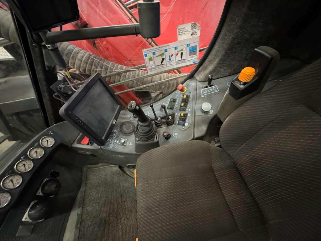 Tractor cab interior with joystick and controls