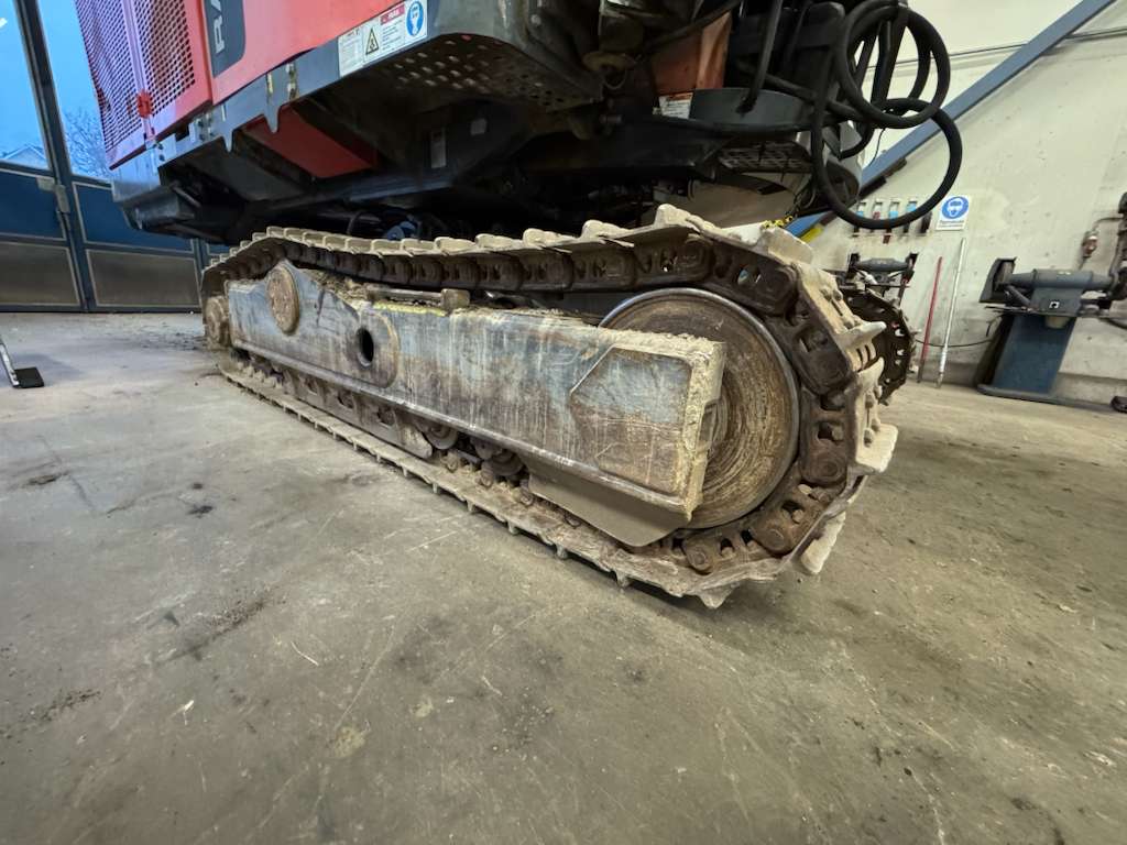 Tracked excavator undercarriage close-up