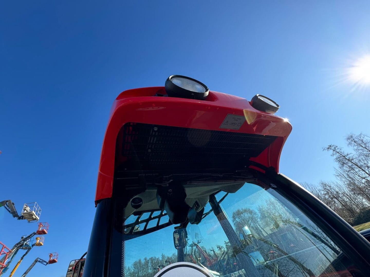 Red tractor cab with roof lights