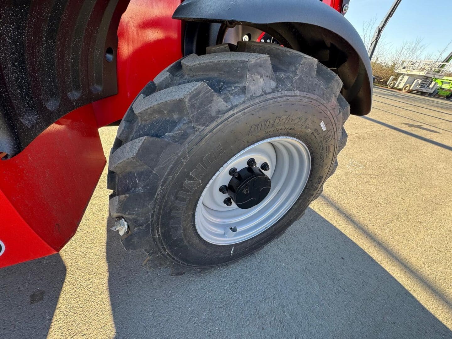 Heavy-duty tire on red construction vehicle