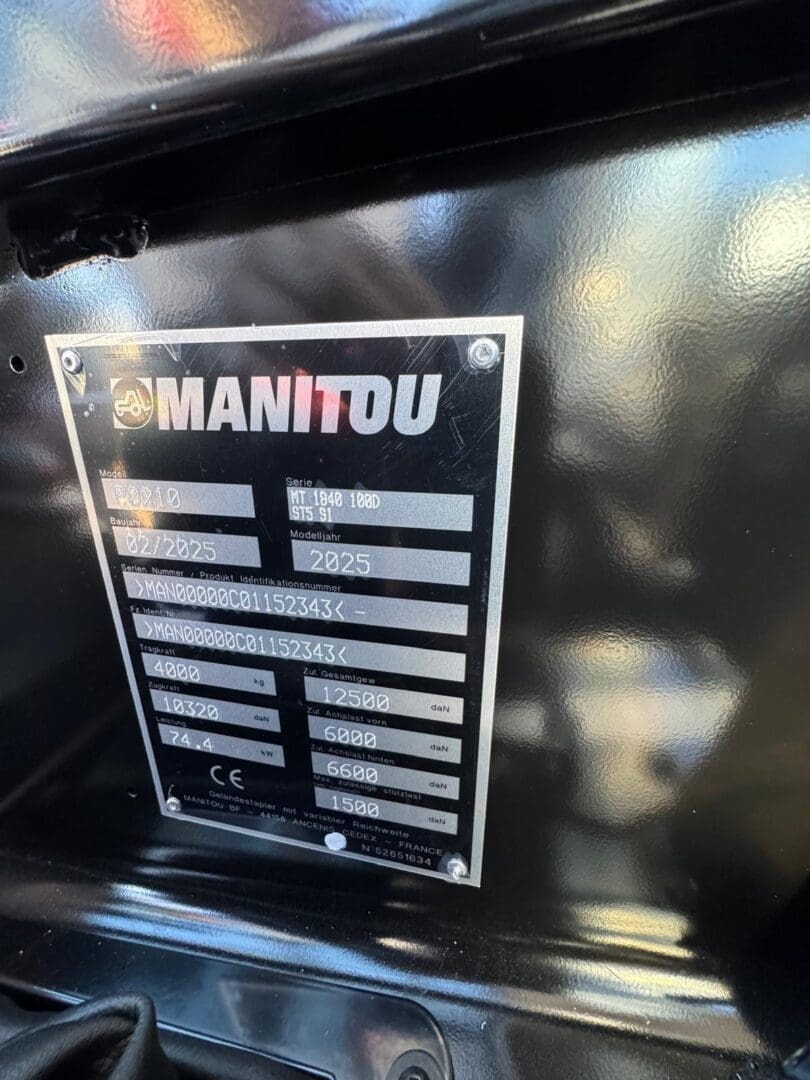 Manitou equipment identification plate on black machinery