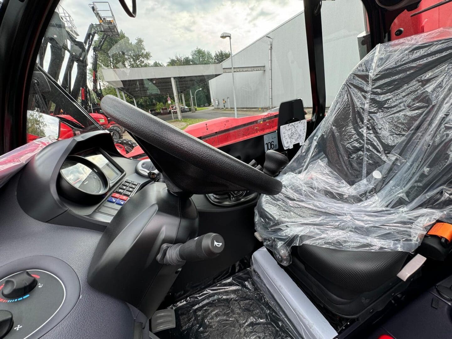 Vehicle cabin interior with plastic-covered seat