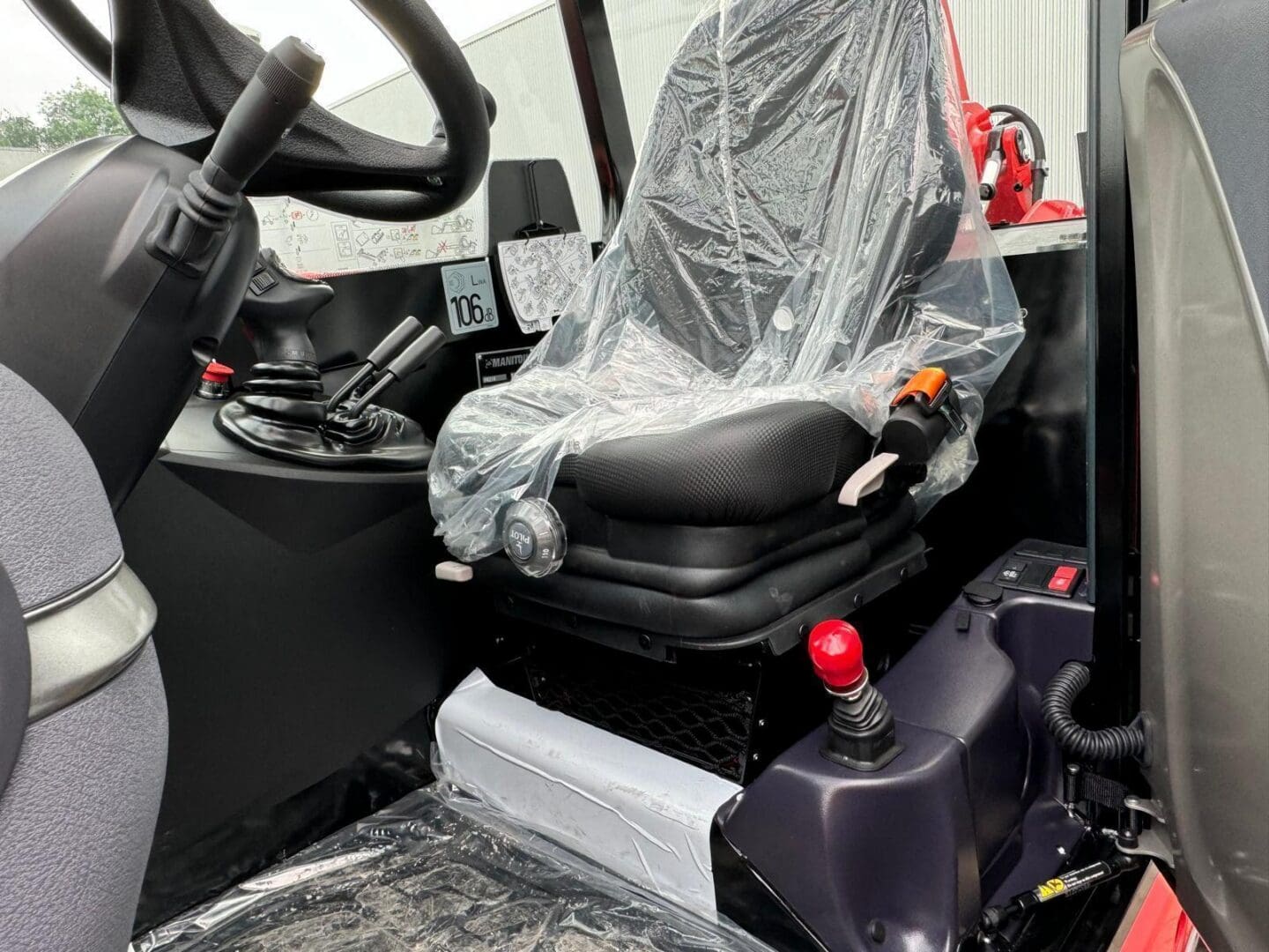 Industrial vehicle cab driver's seat and controls