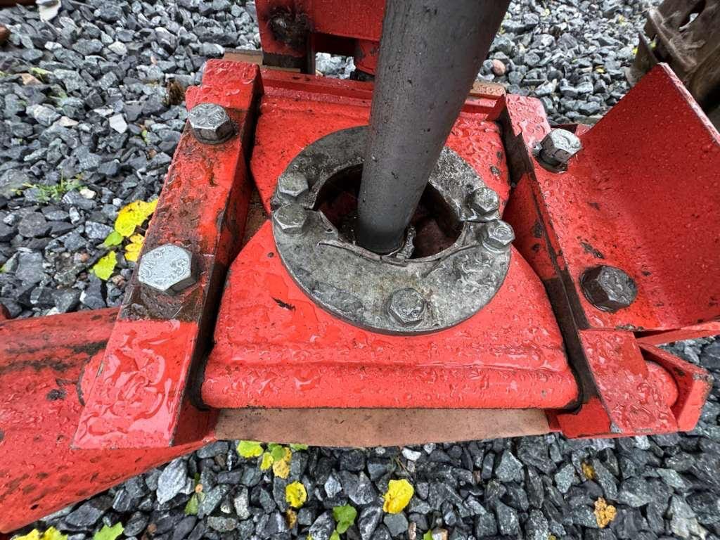 Red metal jack base with bolts