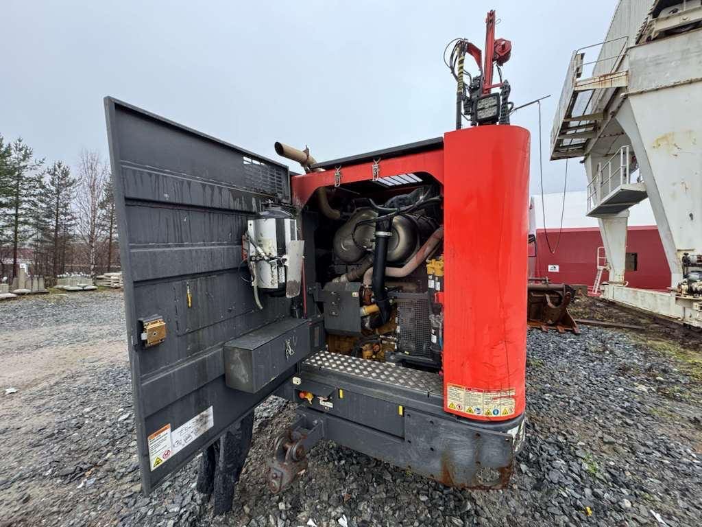 Red industrial generator with open engine compartment