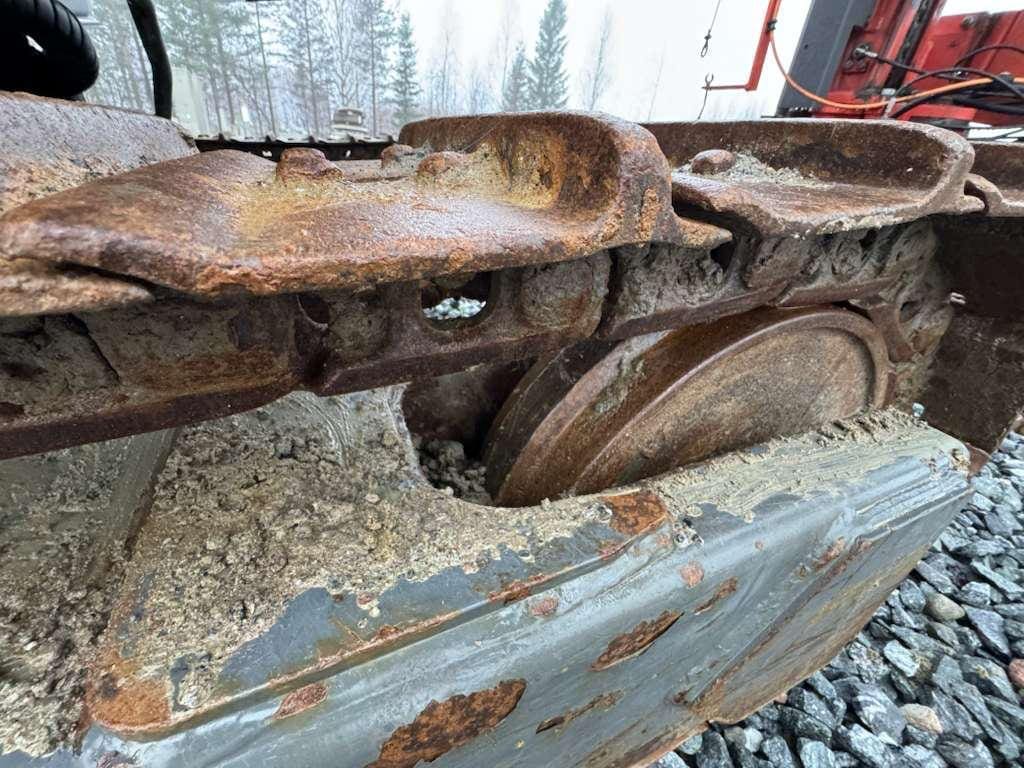 Rusted heavy equipment track and undercarriage