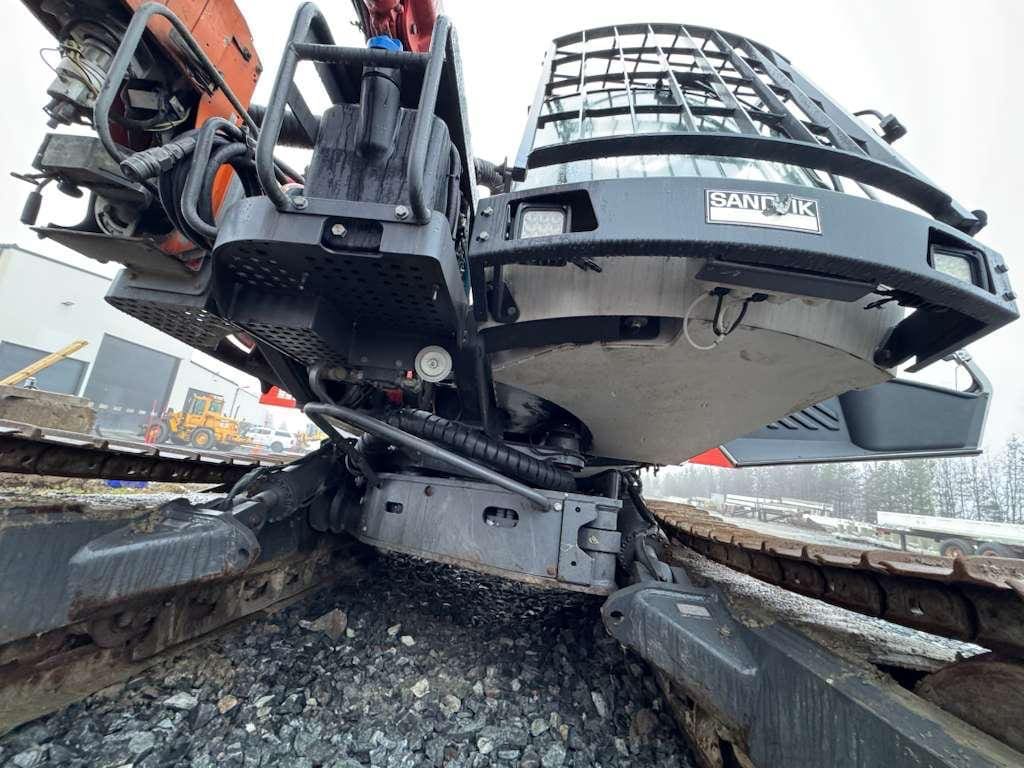 Excavator undercarriage and tracks close-up