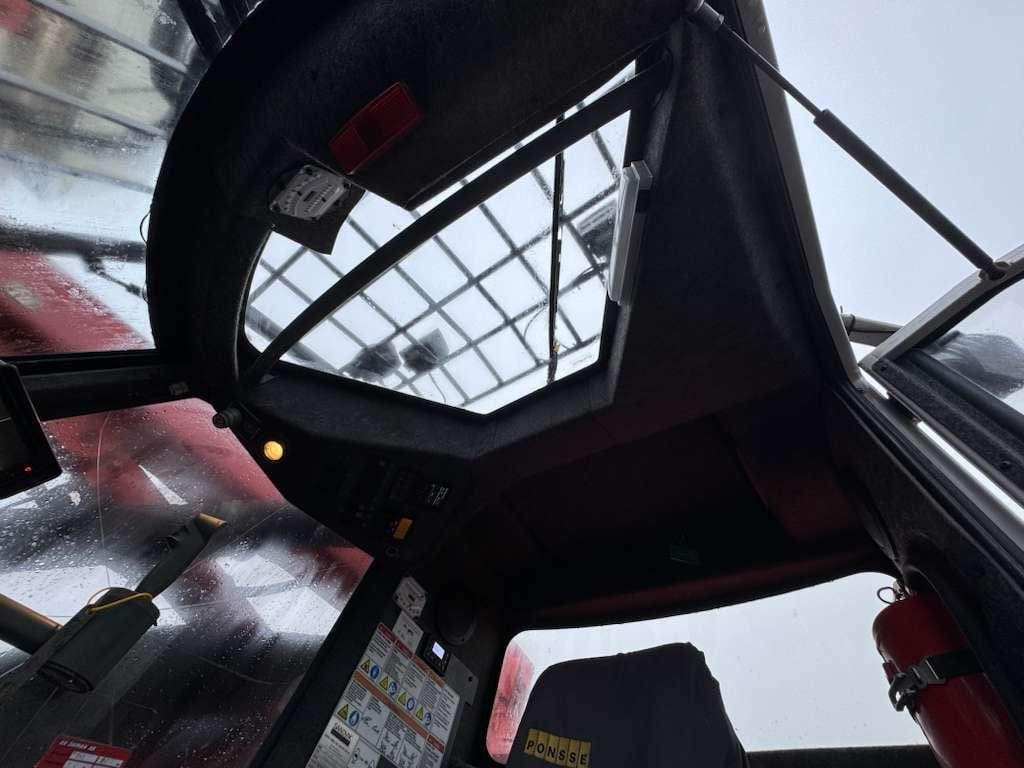 Bus driver's cabin with skylight and fire extinguisher