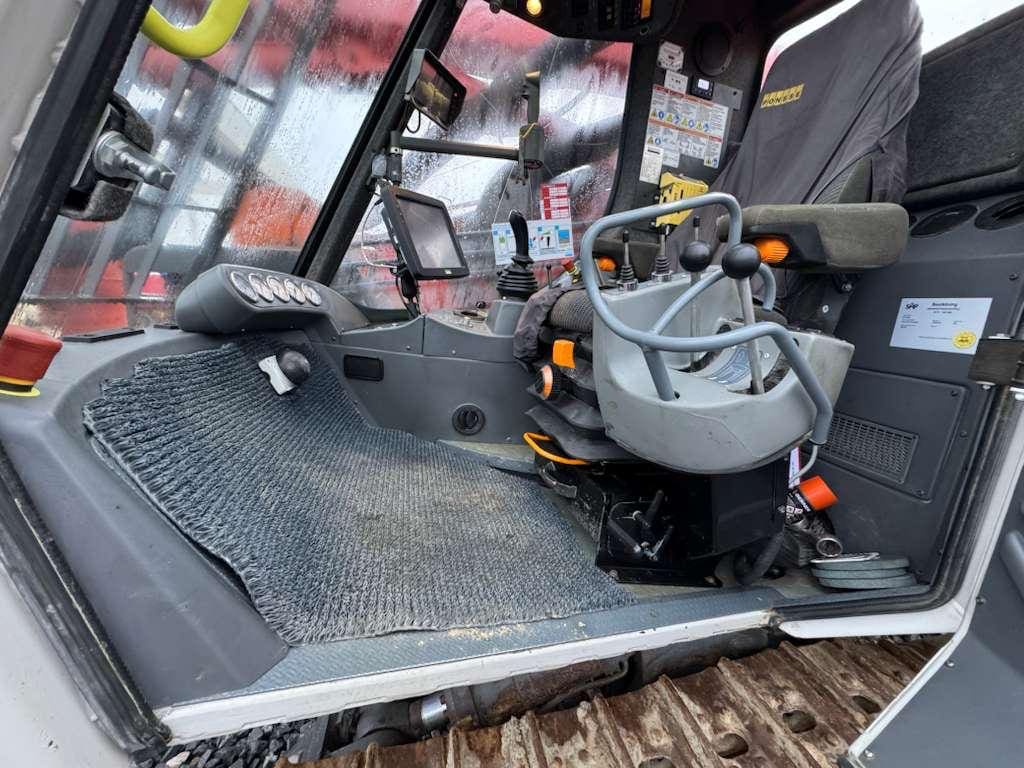 Tracked excavator cab with controls