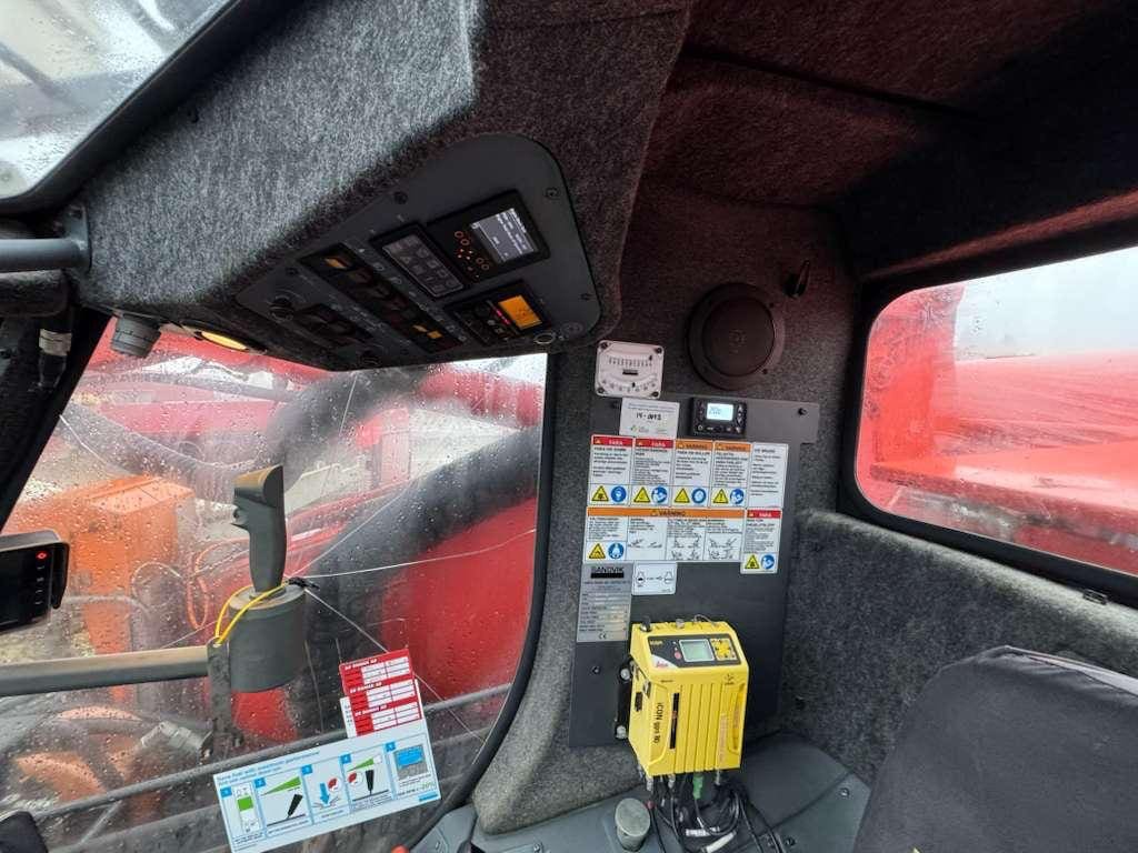 Interior of heavy machinery cab with controls