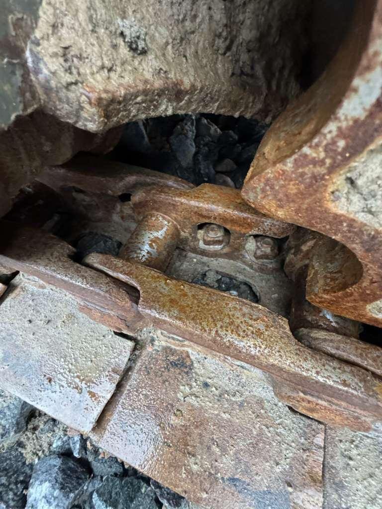 Close-up of rusty track link